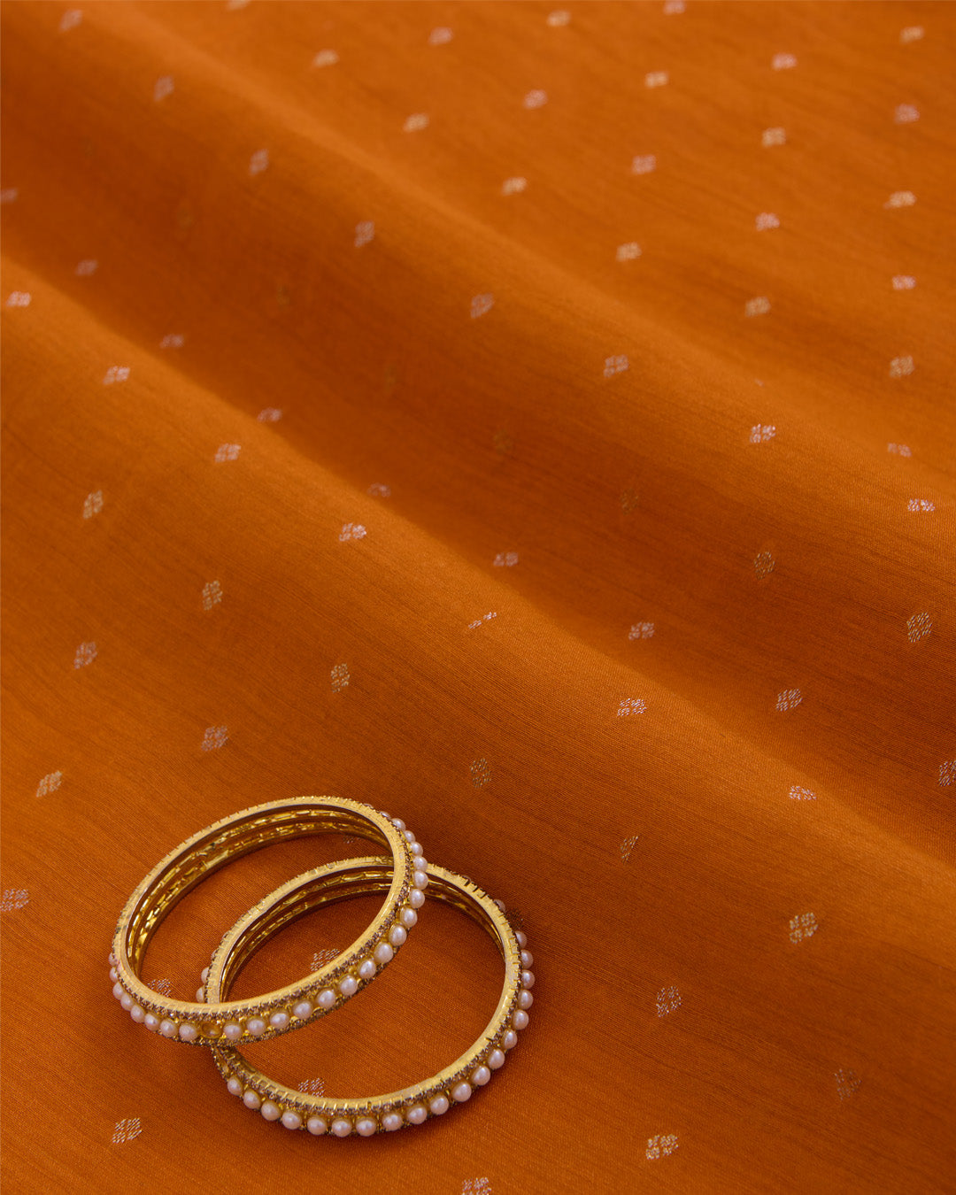 Orange Spun Tussar Gold Silver Zari Buta Woven Fabric
