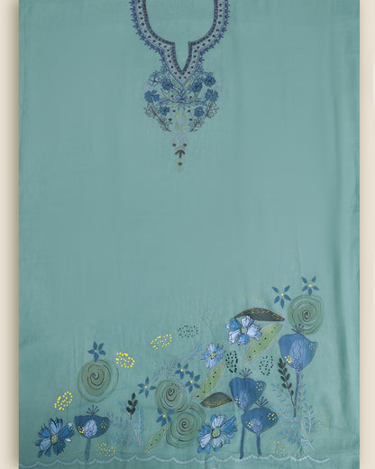A turquoise blue fabric garment, likely a kurta or dress, featuring detailed floral and paisley embroidery. The neckline is adorned with blue and purple embroidery, and the lower hem has a matching floral border in shades of blue, green, and yellow.