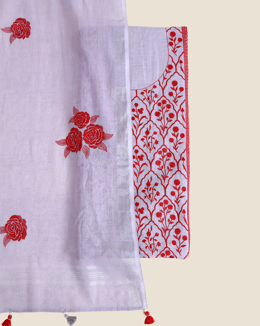 A white semi-sheer fabric panel with red floral embroidery, shown alongside a matching white embroidered blouse piece with red floral and vine motifs, on a light beige background.