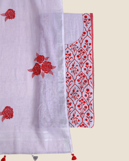 A white semi-sheer fabric panel with red floral embroidery, shown alongside a matching white embroidered blouse piece with red floral and vine motifs, on a light beige background.