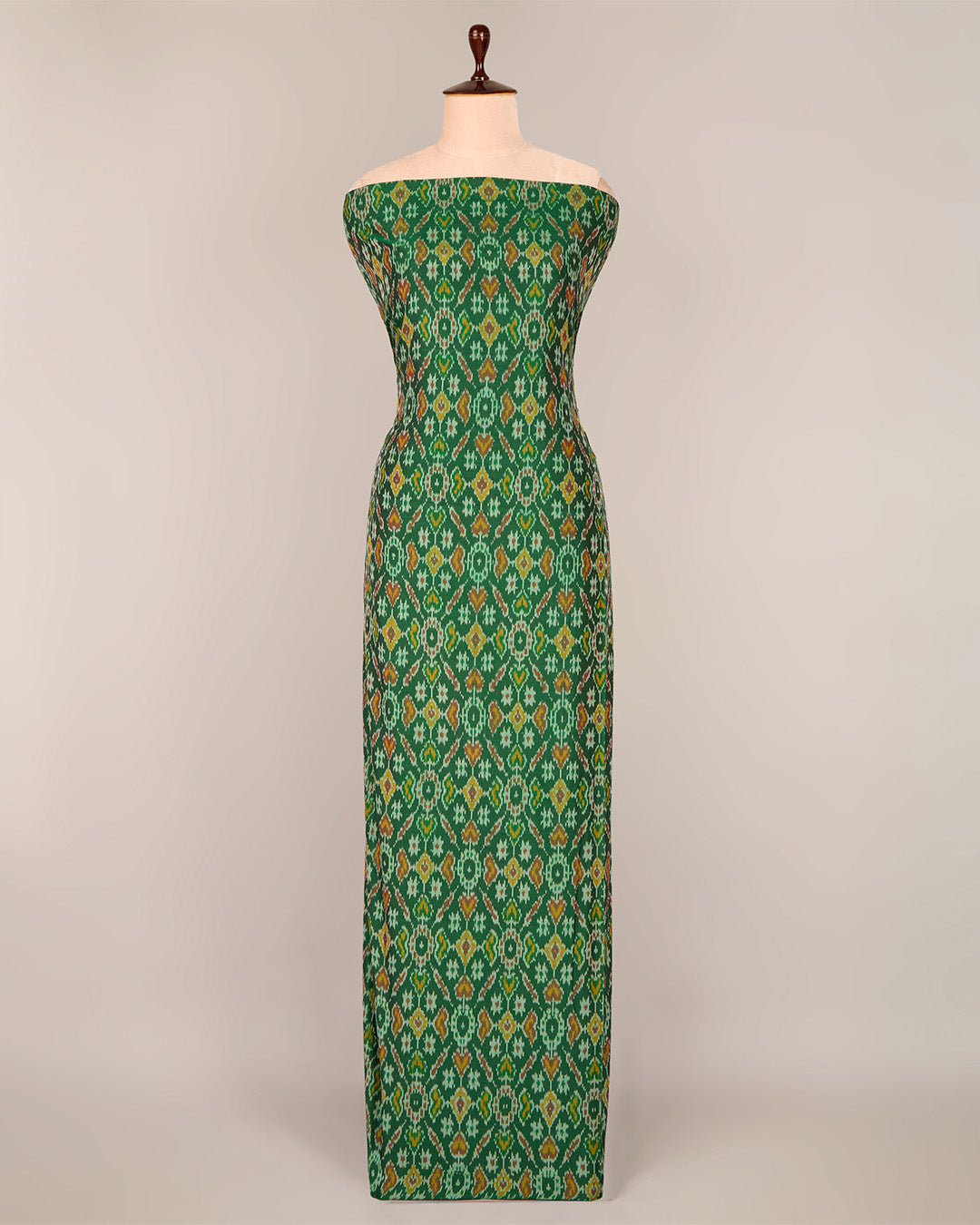 Bottle Green Cotton Silk Ikat Fabric with intricate woven pattern