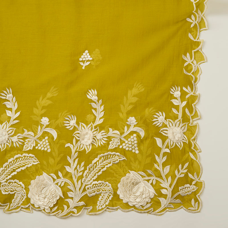 Mustard yellow fabric with white floral embroidery