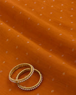 Orange Spun Tussar Gold Silver Zari Buta Woven Fabric