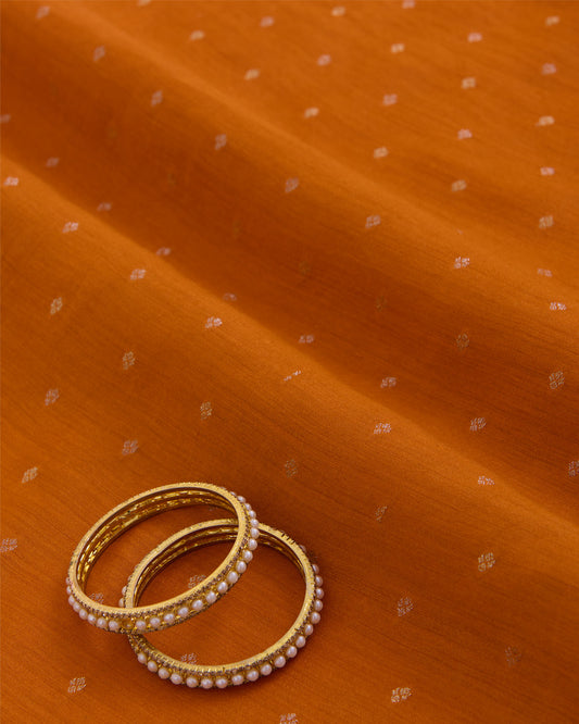 Orange Spun Tussar Gold Silver Zari Buta Woven Fabric