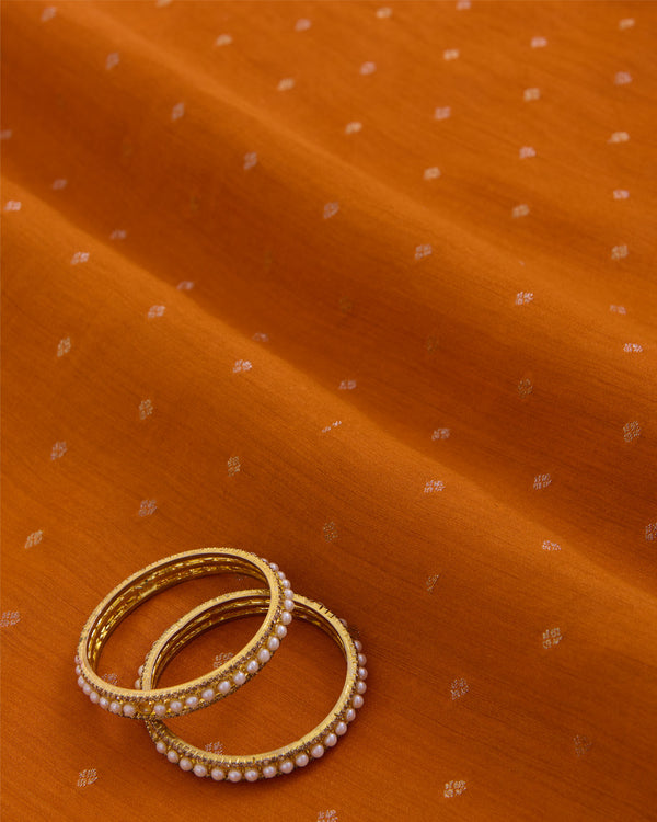 Orange Spun Tussar Gold Silver Zari Buta Woven Fabric